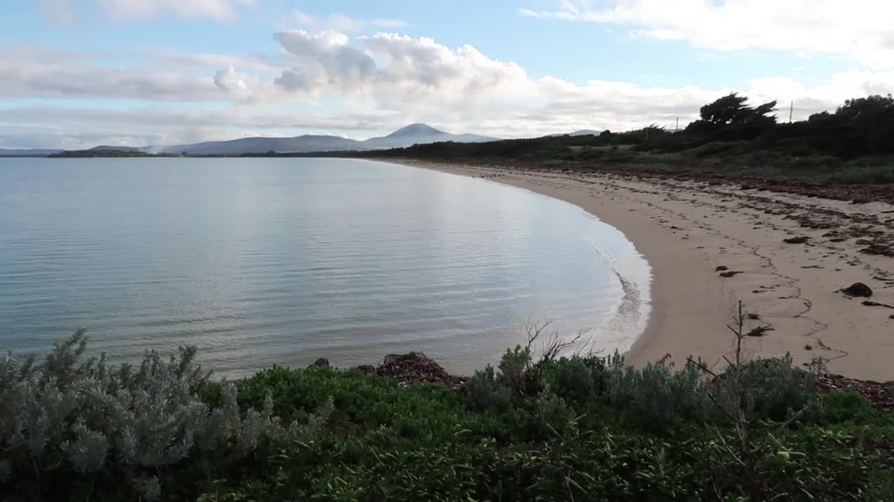 A tranquil view of an isolated beach on an island