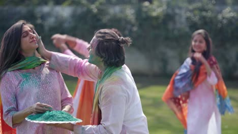 indian man surprises his partner on holi