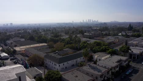 wide aerial panning shot above west hollywood with century city in the distance