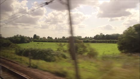 A-passenger-view-of-a-mainline-train-journey-in-England,-United-Kingdom,-from-Retford-to-King's-Cross-Station