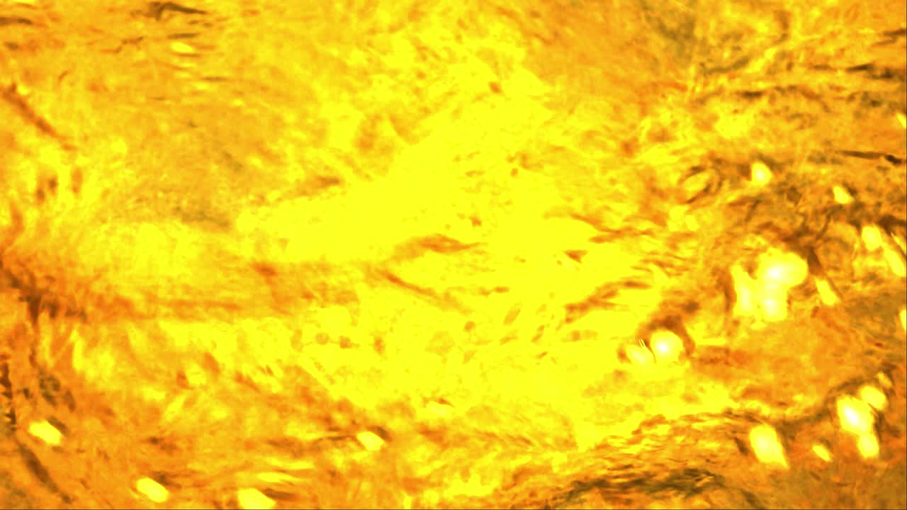 Animation graphique d'un effet d'eau dorée qui s'écoule, pour utilisation en fond vidéo