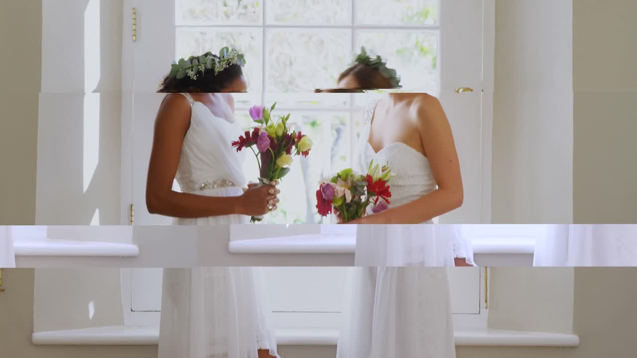 Two bridesmaid standing near the window with a bouquet 4K 4k