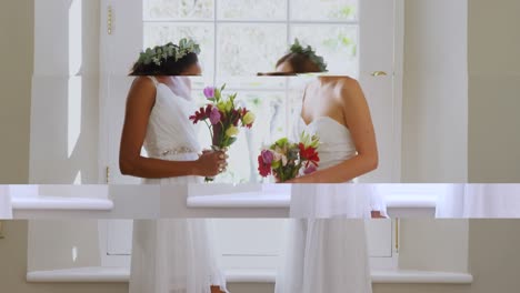 Two-bridesmaid-standing-near-the-window-with-a-bouquet-4K-4k