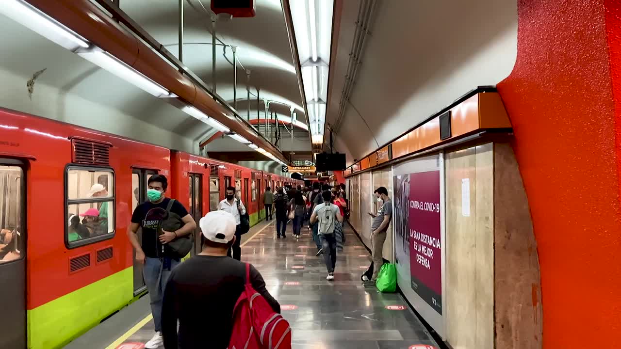 Subway station during “the new normal” post covid 19 in Mexico City, people wearing face mask in subway