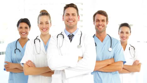 happy medical team with arms crossed