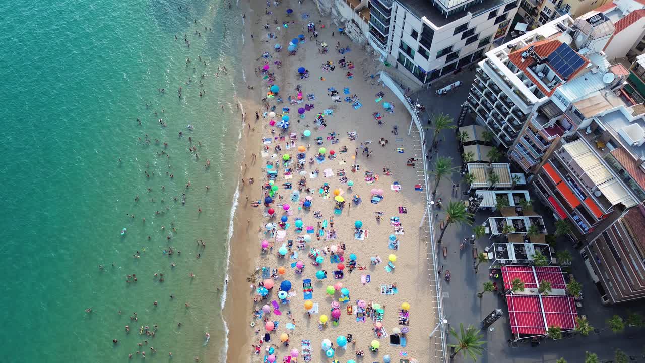 Benidorm Levante beach Spain aerial drone summer holiday season full of people crowded busy