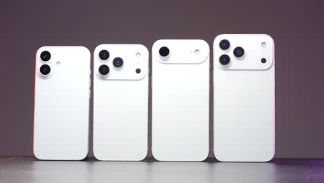 four smartphones lined up showing different camera designs