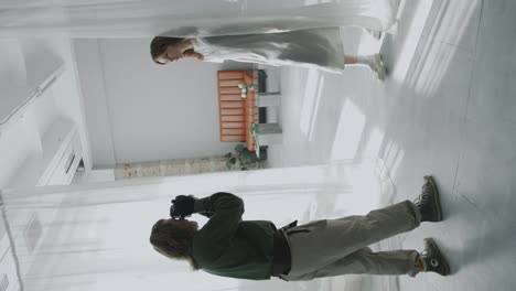 photographer directing model during photo shoot in minimalist studio