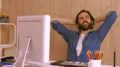 hipster worker relaxing at desk