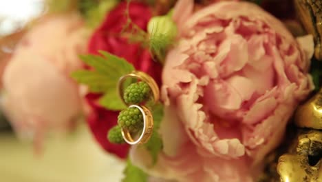 wedding rings in a floral bouquet