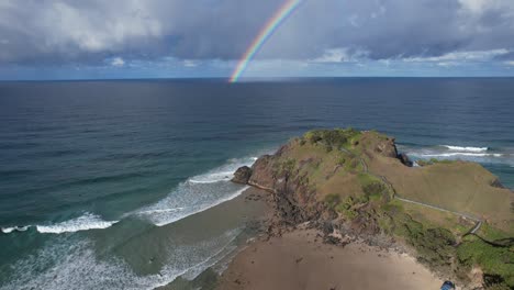 Norries-Headland-With-Rainbow-Over-The-Sea-In-NSW,-Australia---aerial-drone-shot