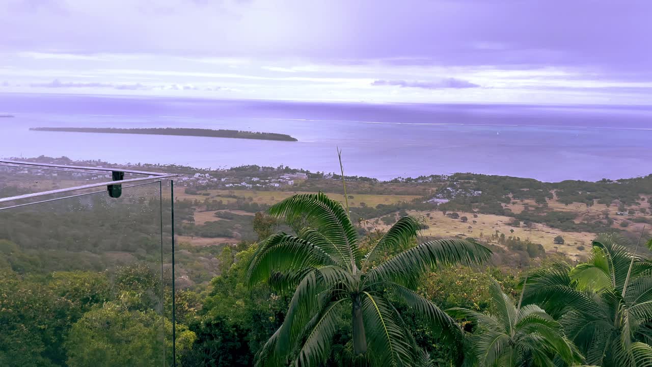 A quiet path near the Mauritian coast at dusk, framed by pastel skies and serene views