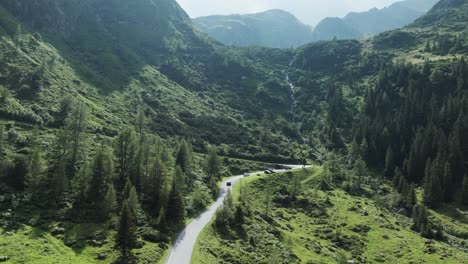 aerial drone footage capturing winding road through sölktäler valley in styria, austria