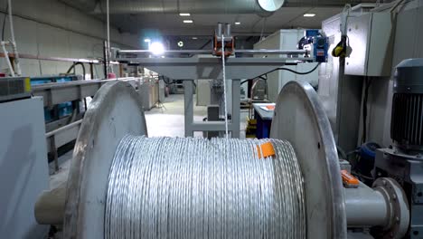 an electrical cable in isolation is wound on a metal coil