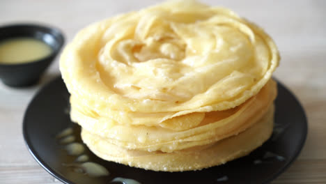 fried crispy roti dough with sweetened condensed milk