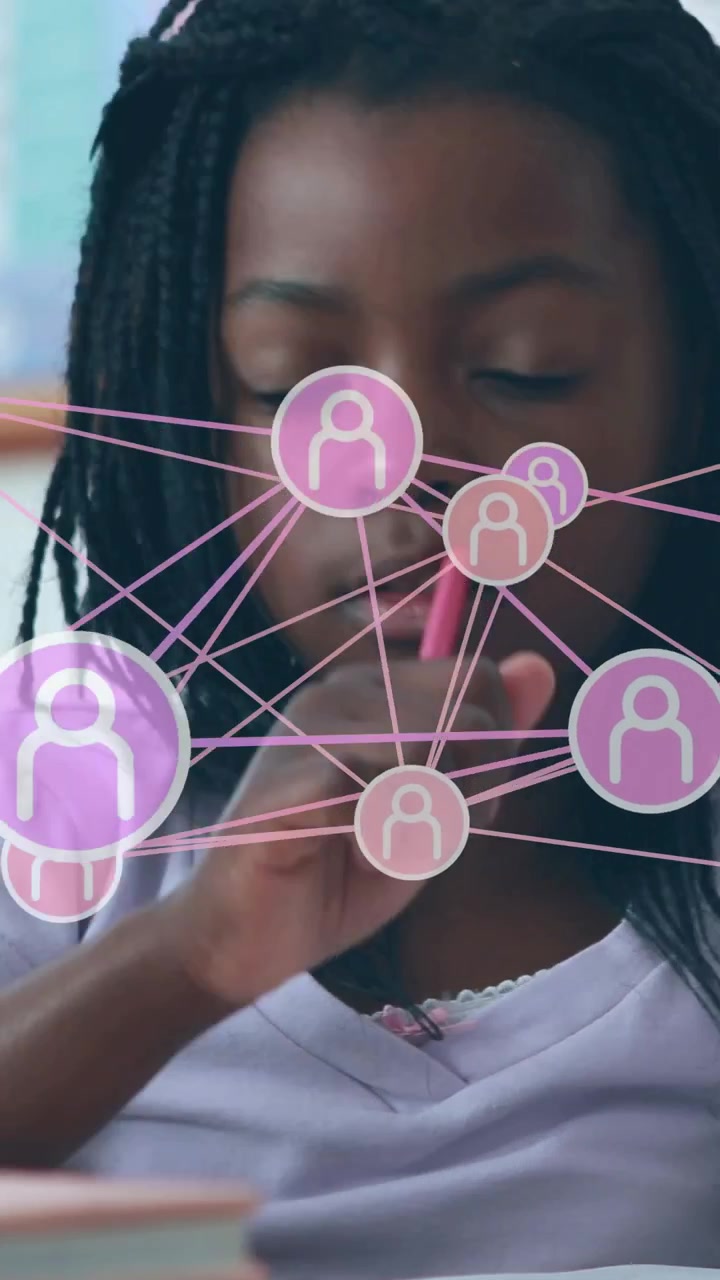 Vertical video: Girl student tapping pink pencil causing network overlay and writing for classwork