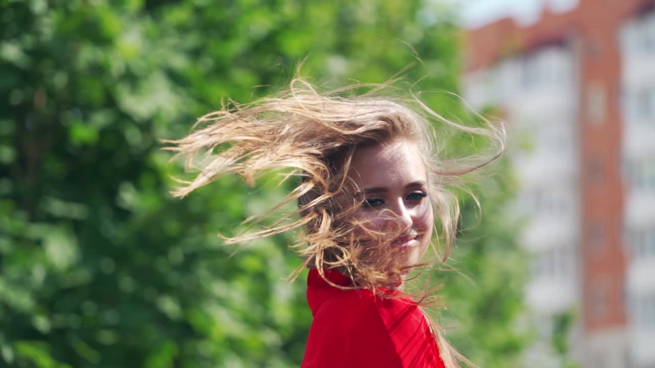 Portrait of beautiful woman. Happy woman in dress walking outdoors