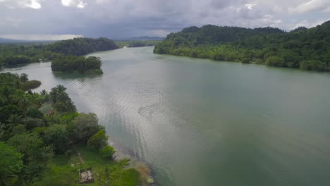 an aerial over a small village on the rio dulce river in guatemala 1
