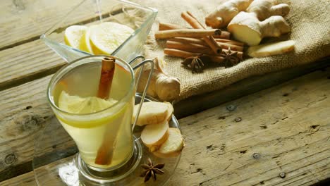 Herbal-tea-with-lemon,-cinnamon-sticks-and-ginger-4k