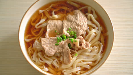 homemade udon ramen noodles with pork in soy or shoyu soup