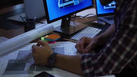 businessman working in a modern office by night