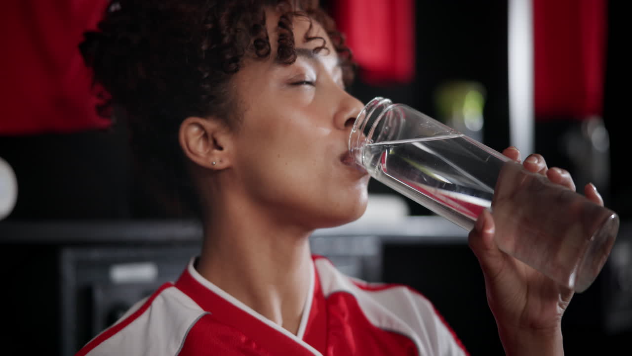 Athlete drinking water
