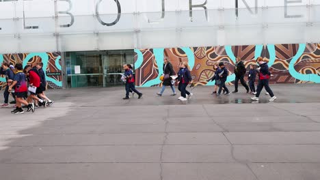 group of children walking outside melbourne museum