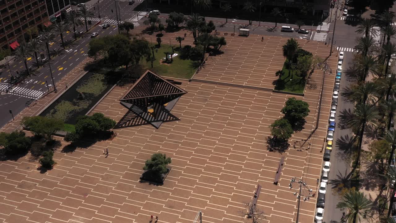 Aerial View of a City Plaza with Sculptures and Trees