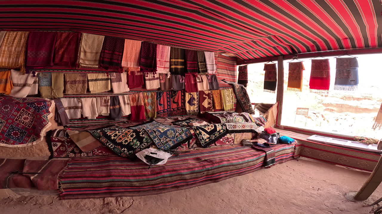 Little rural shop of Bedouins selling the pashminas and kerchiefs. Small store on the way to Petra, Jordan, West Asia.