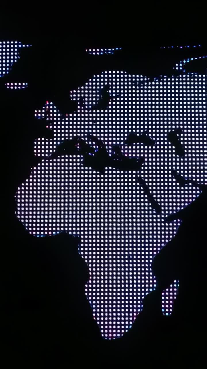 Vertical video: Materializing LED map on dark backdrop, highlighting west Africa with red indicator