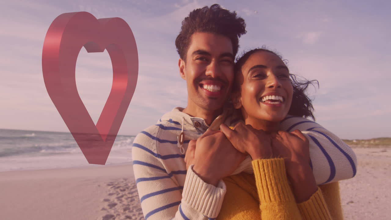 animación de corazón rojo sobre una pareja enamorada abrazándose en la playa
