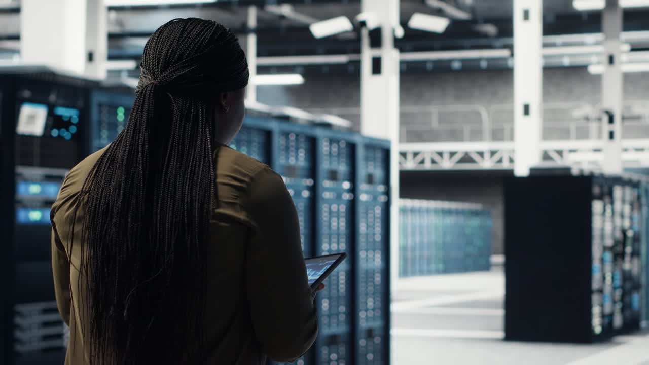 Data center software developer doing AI data analysis on tablet