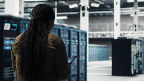 data center software developer doing ai data analysis on tablet