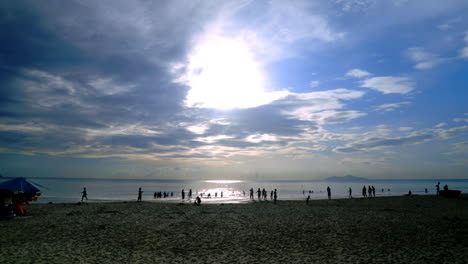 standing and looking at the sunrise in da nang in the morning.