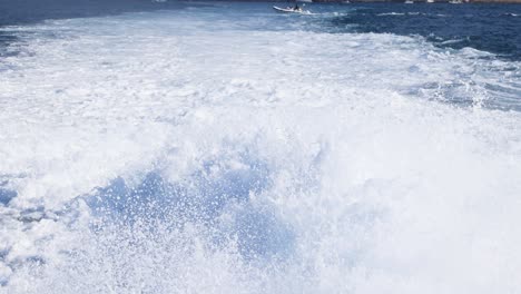 boat moving, creating large water splash