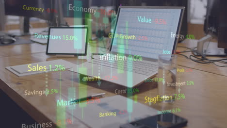 animation of financial data processing over laptop and tablet on desk at office