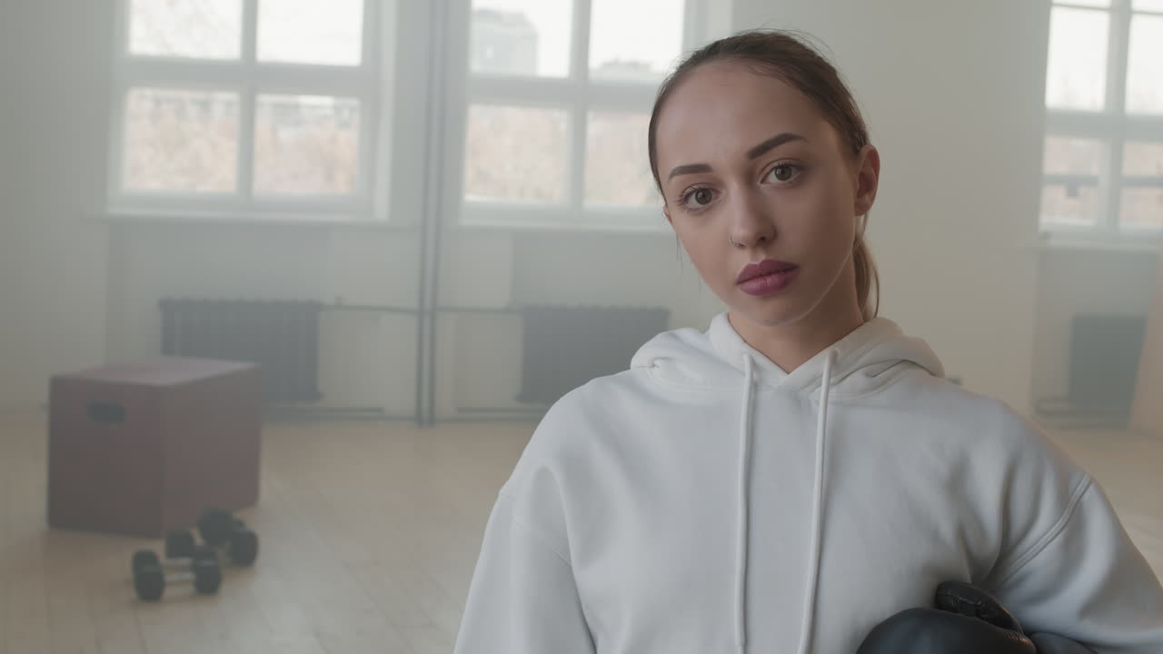 Portrait Of Female Fighter With Boxing Gloves