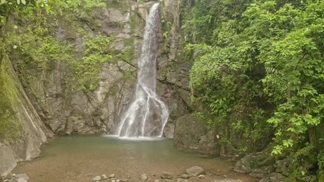 Shot-of-remote-Lumondo-waterfall-deep-inside-the-jungles-of-Alegria,-Philippines-at-daytime