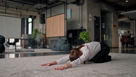 businesswoman stretching in office