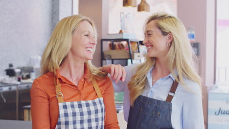 portrait of female owners or workers in coffee shop or restaurant