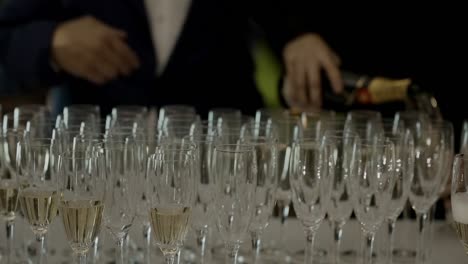 champagne being poured into flutes