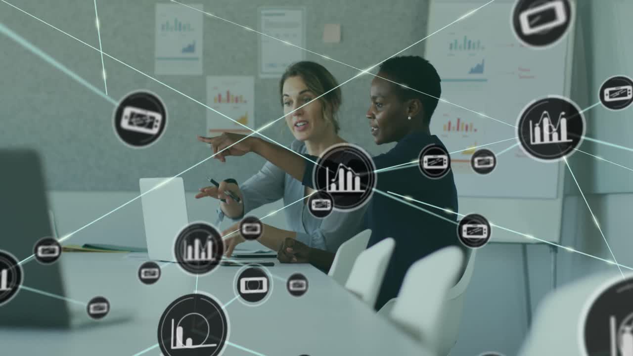 Animation of connected icons over diverse female coworkers discussing report on laptop at office