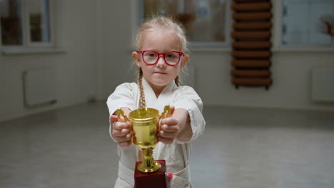 girl in white kimono in martial arts class