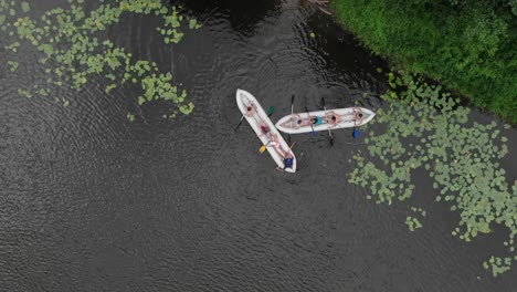 aerial drone top view shot of two dinghy boats racing in a lake