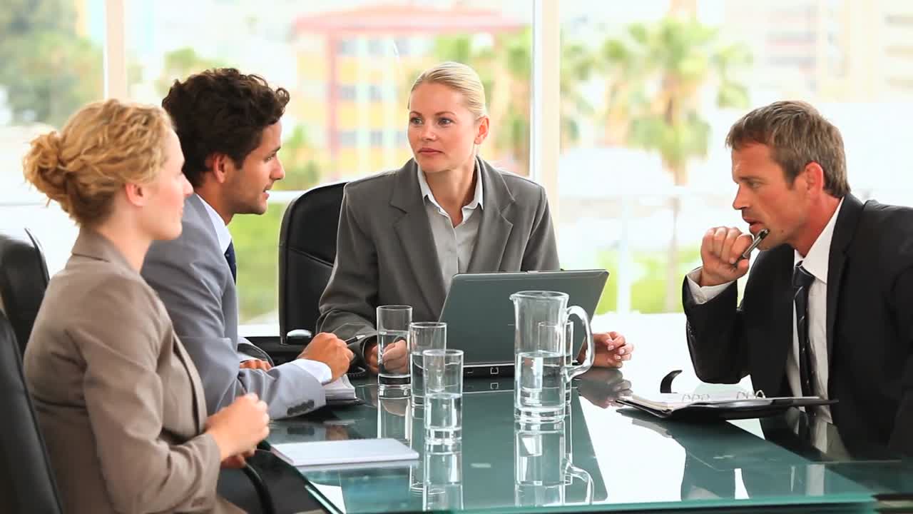 Discusion between four business people
