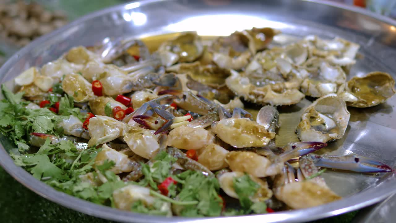 Inox plate with raw blue crab spicy sauce ready to cook street food, Bangkok