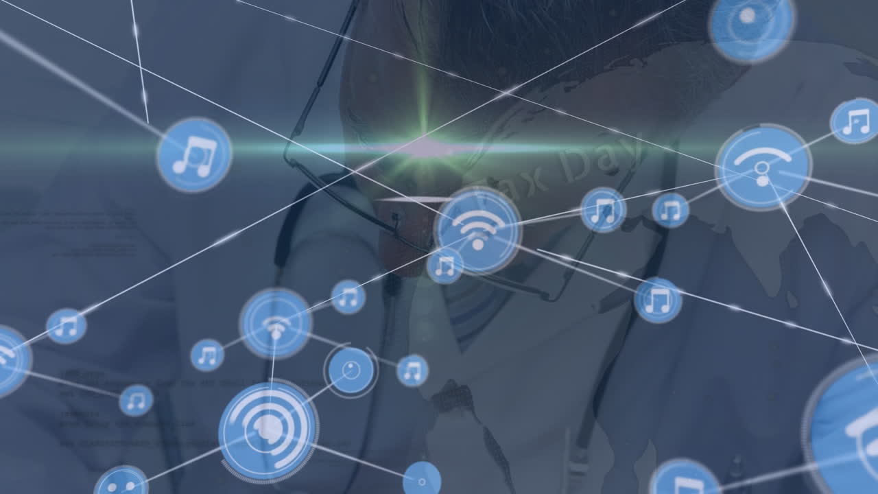 Animation of media icons over caucasian male doctor writing