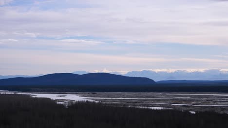 panning shot of alaskan river and mountains