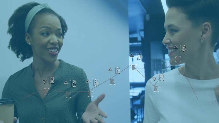 Animation of data processing and diagrams over diverse female colleagues discussing work in office