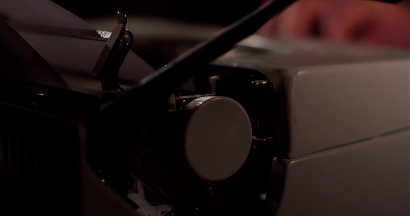 Close-up of Hands Typing on a Vintage Manual Typewriter